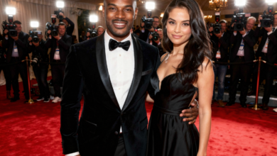 Berniece Julien inspired elegant businesswoman with partner at red carpet event